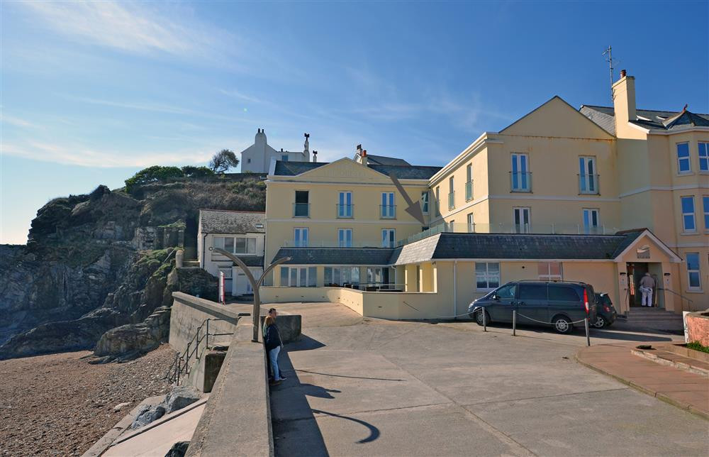 Modern apartments in this prominent old building nestled into the cliffside at Torcross with No 7 arrowed.