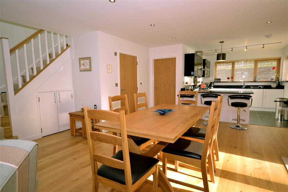 Another view of the kitchen and dining area