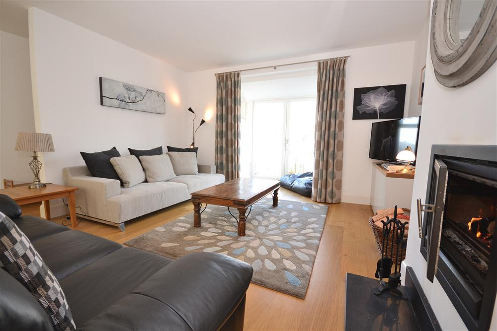 The lounge area and contemporary wood burner.