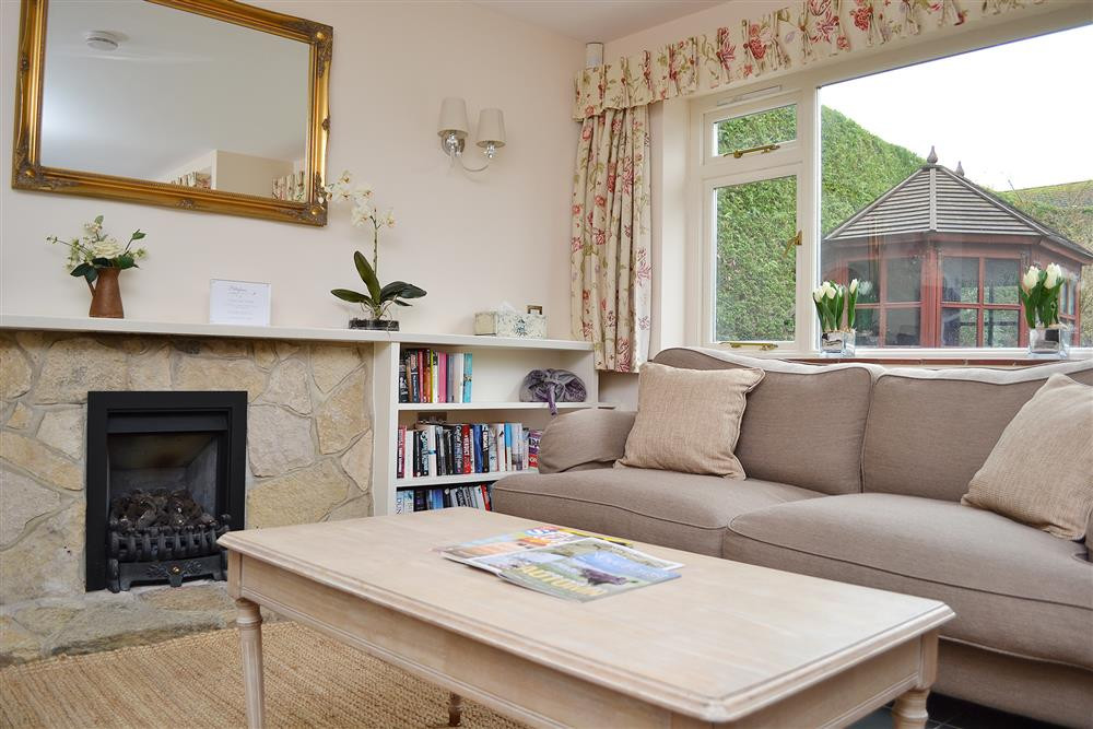 Living area with windows overlooking the garden