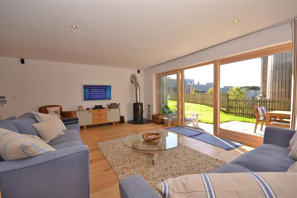 Another view of the living room, showing the woodburner