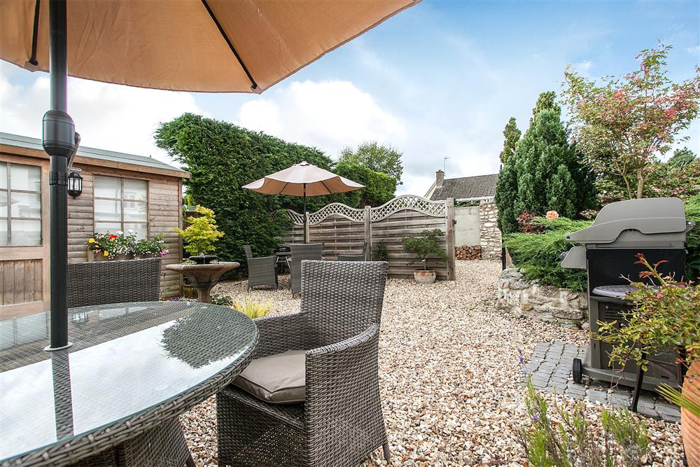 Garden furniture and barbecue provided for guests