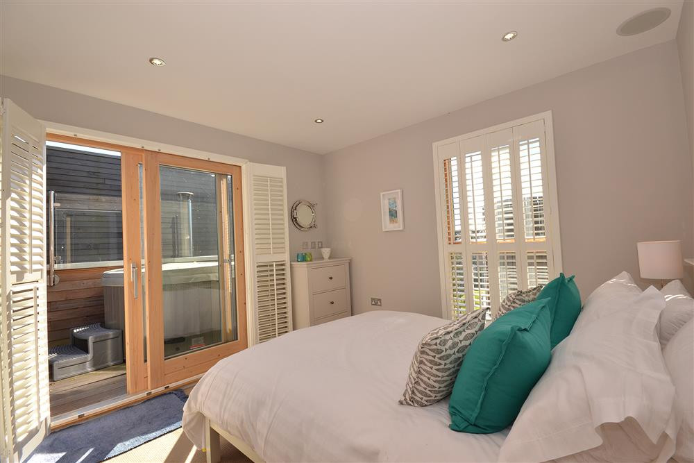 The master double bedroom showing the hot tub on the balcony