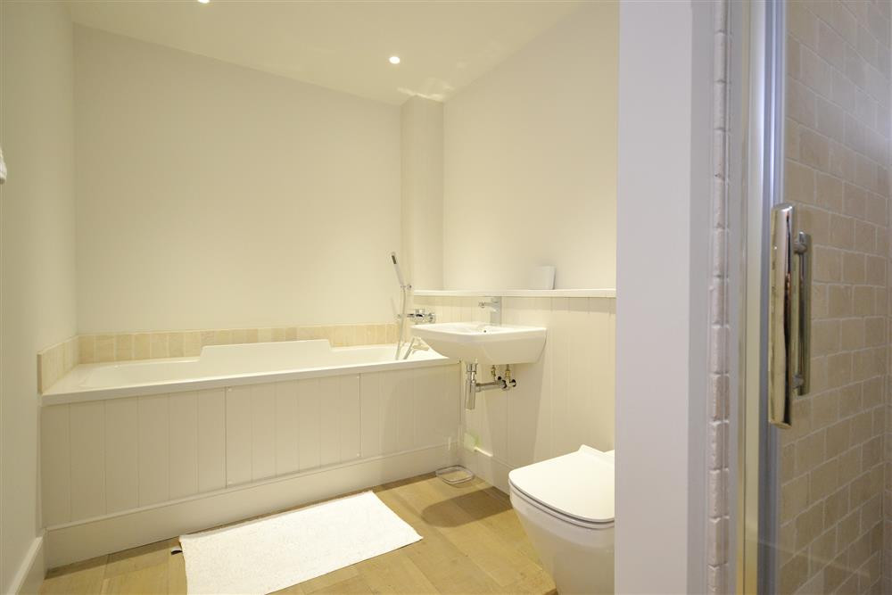 The family bathroom with bath and separate shower cubicle