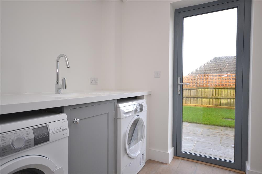 The utility room with access to the enclosed garden