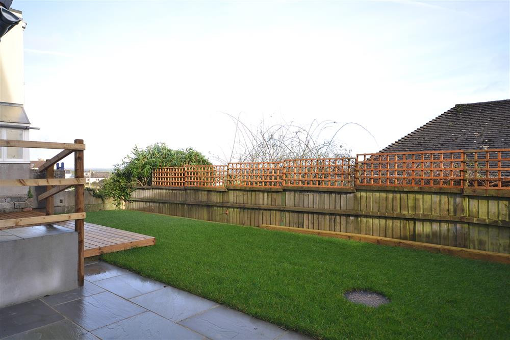 Enclosed garden with patio area