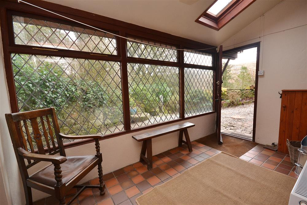 The front door opening into the conservatory porch.
