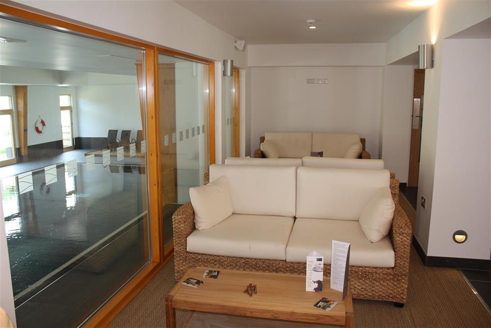 Seating in the reception area by the indoor pool