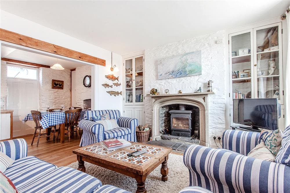 The delightful sitting room with woodburner stove.