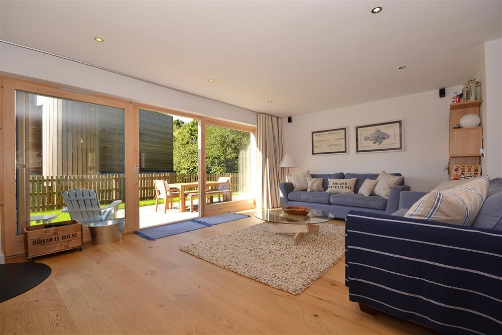 The living room looking towards the outside decking area