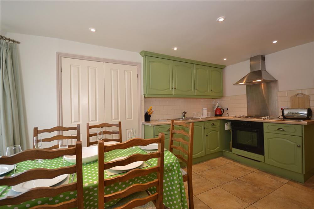 Another view of the kitchen and dining area