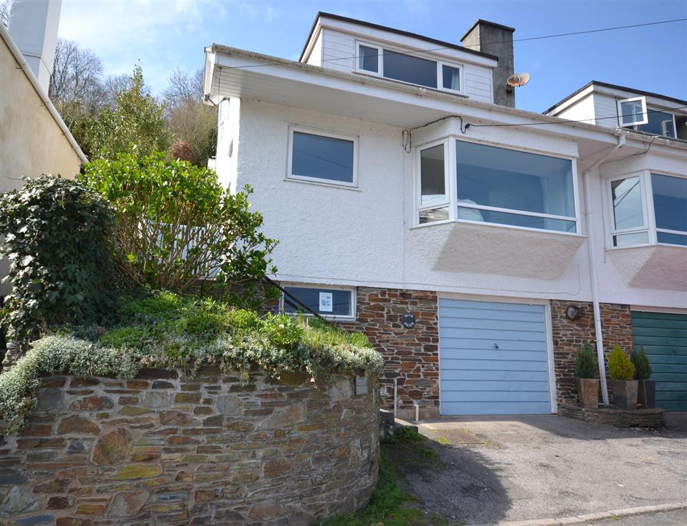 Blue Skies exterior with parking space.