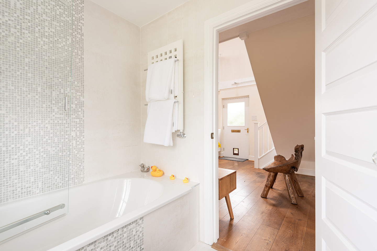Family bathroom through to ground floor hallway.