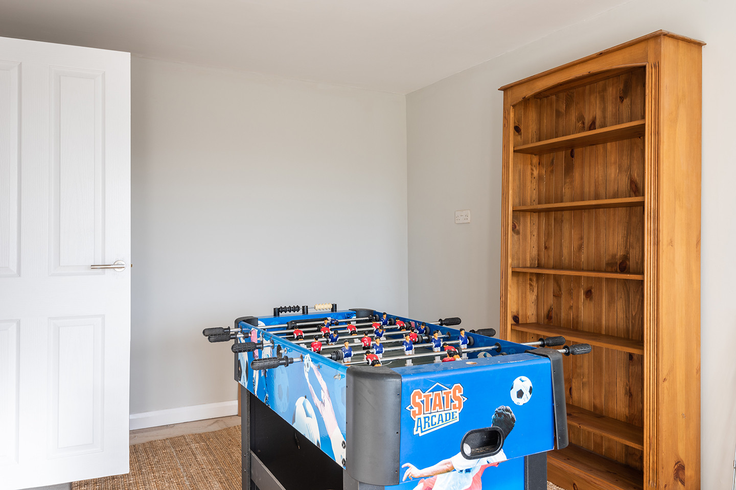 The play room with table football and dart board