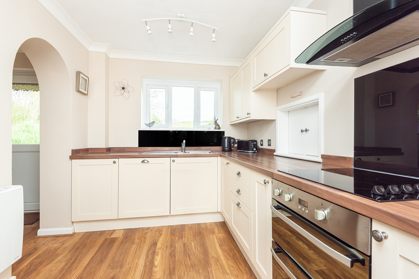 Well equipped kitchen with views over the garden and out over fields beyond in South Devon