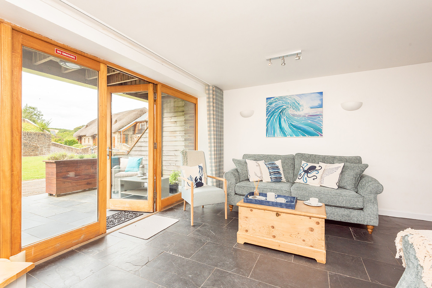 Bright sitting area with double doors to the patio