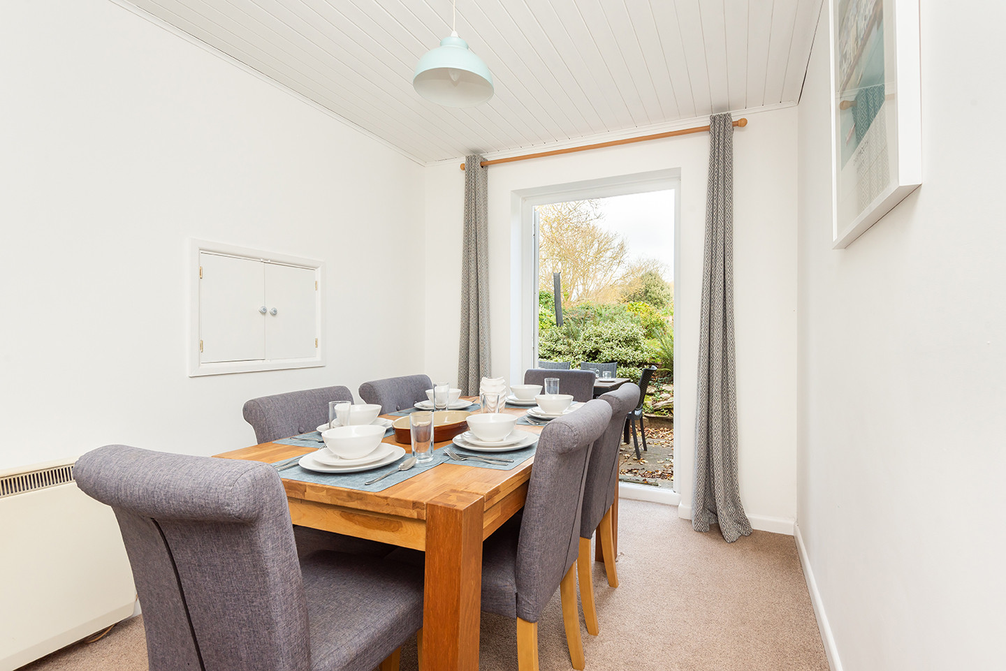 The dining area with doors out to the garden -great for summer holidays in South Devon