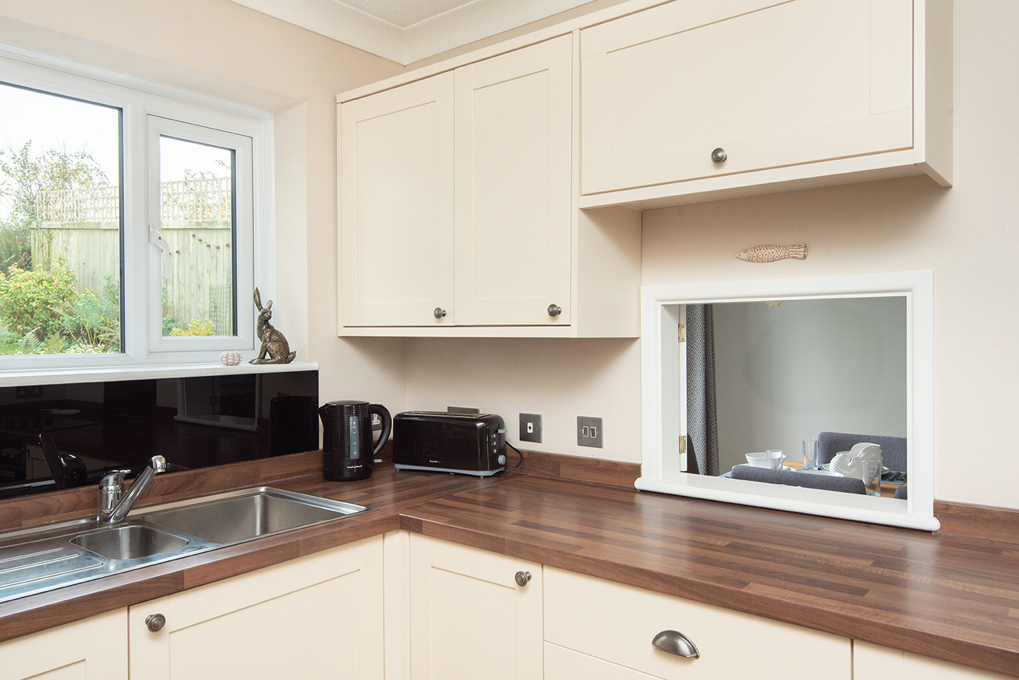 The hatch conveniently opens up to the dining room to pass those tasty holiday treat meals through