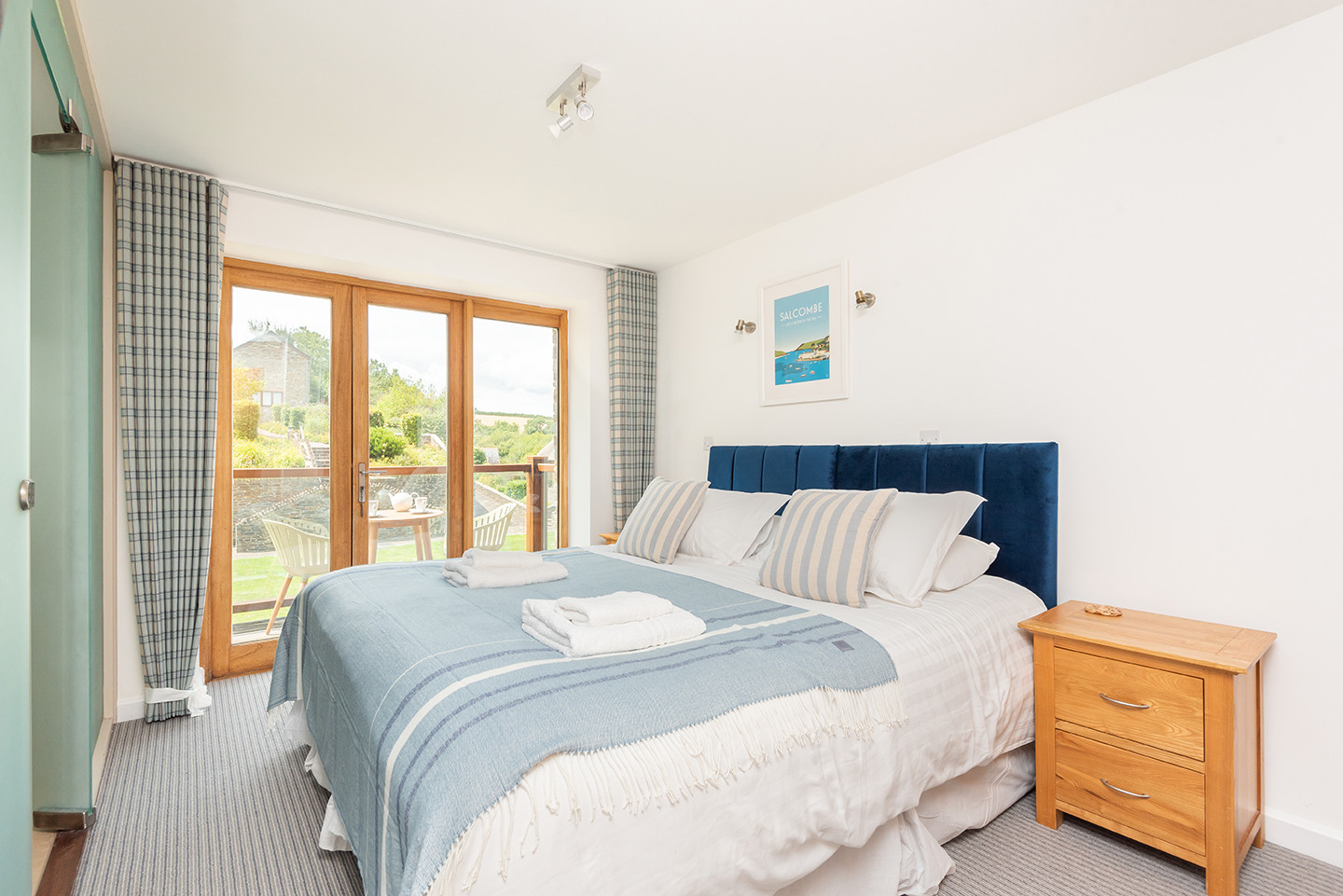 Bedroom 1 with 6ft super king zip and link bed and doors to large balcony