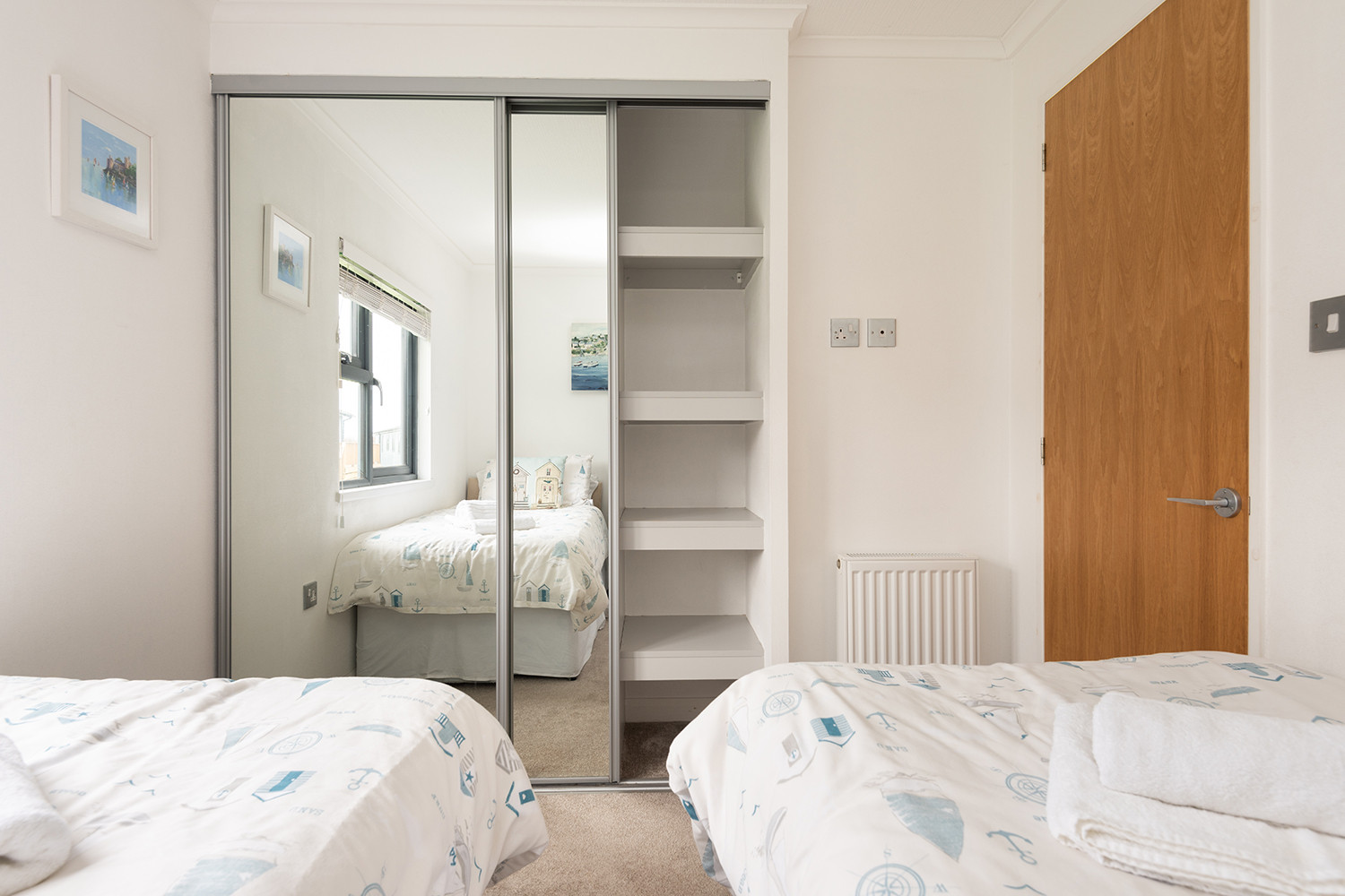 The twin room showing large wardrobe.