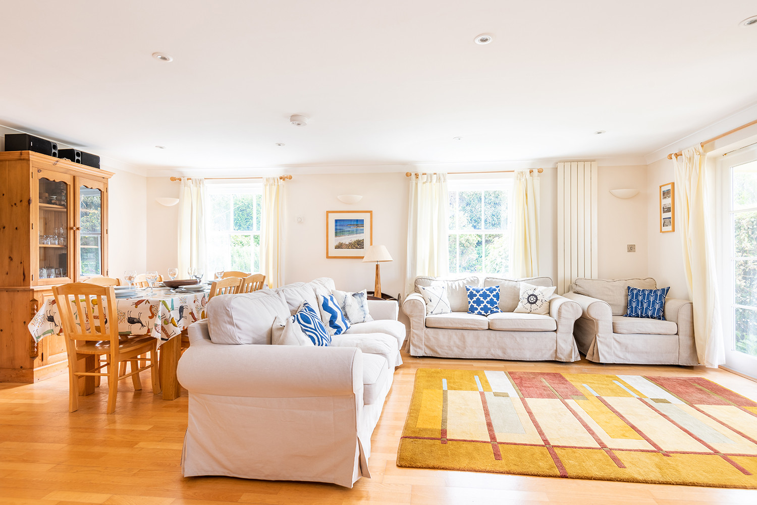 The bright sitting room, with doors to the patio 