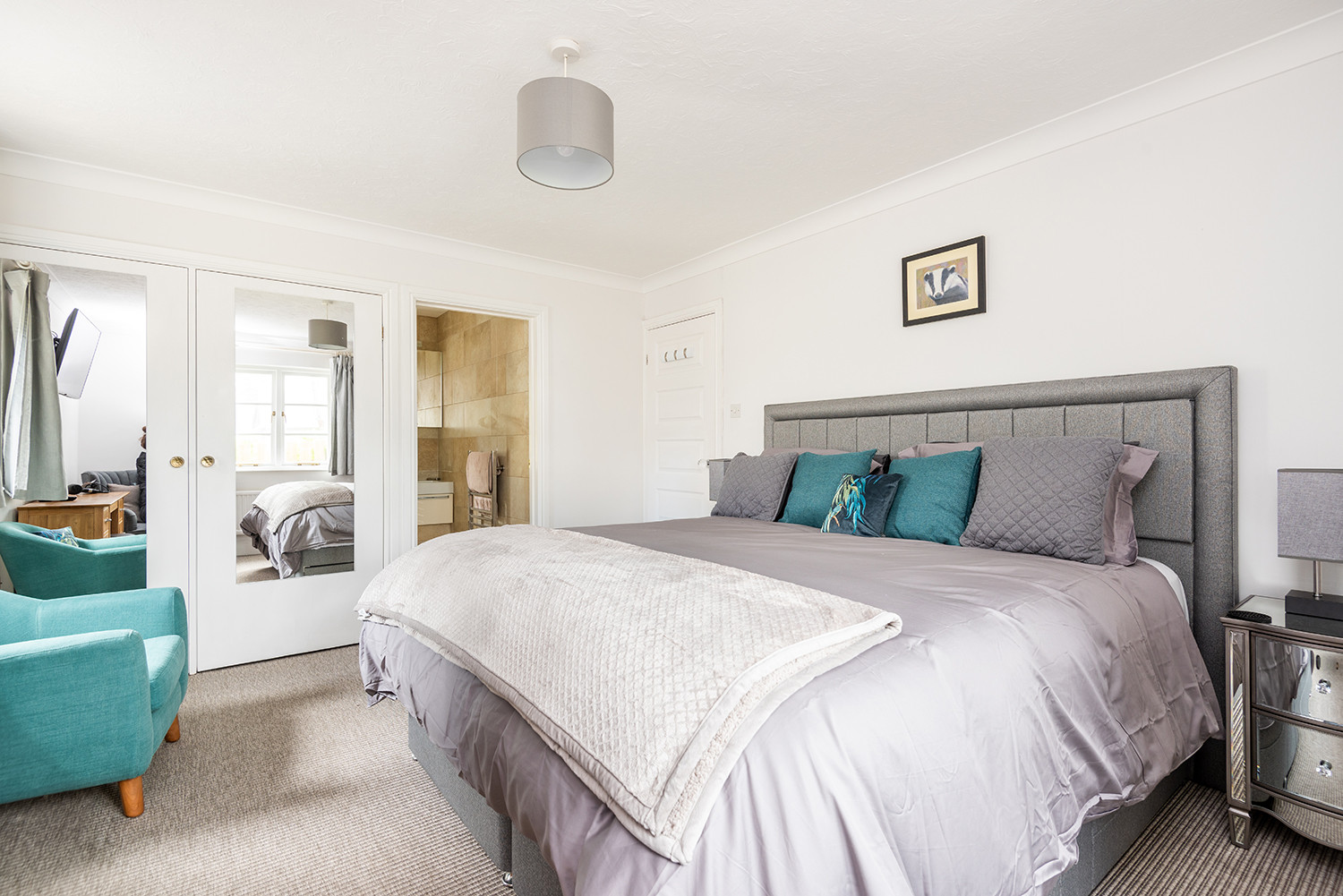 Spacious master bedroom with smart TV and super king size bed.