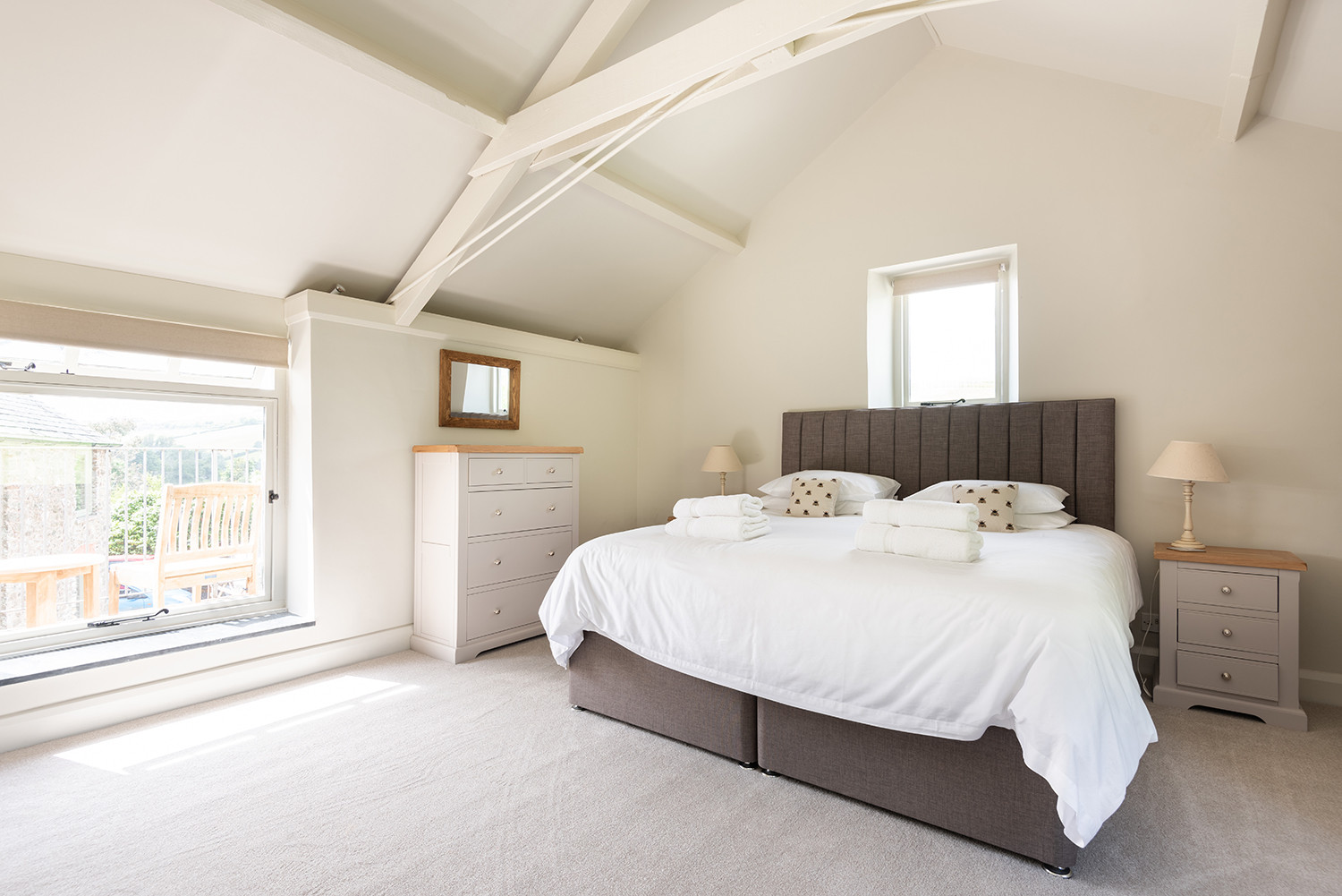 The master bedroom with views over the paddock to the rear.