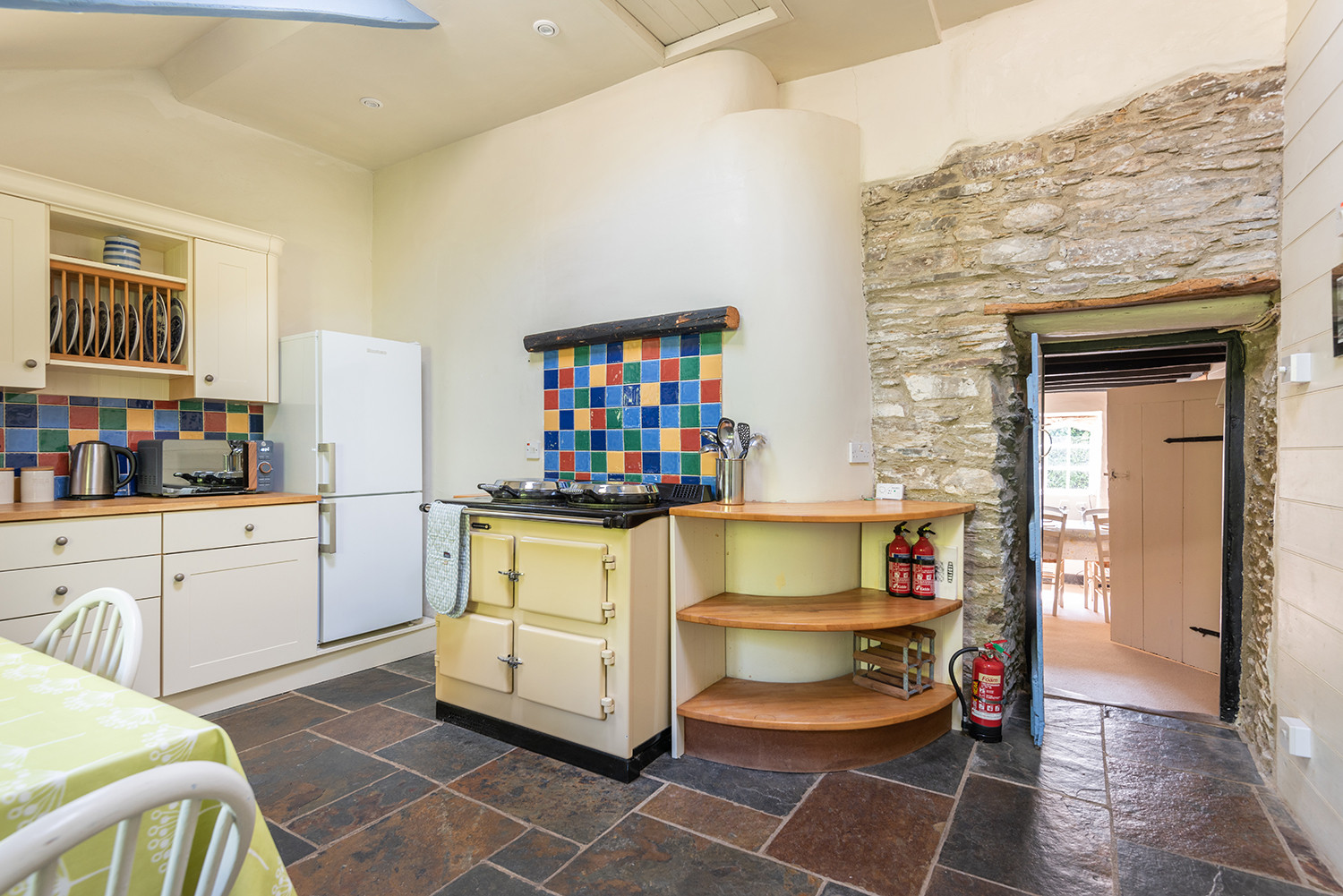 Showing the door leading from dining room into the kitchen.