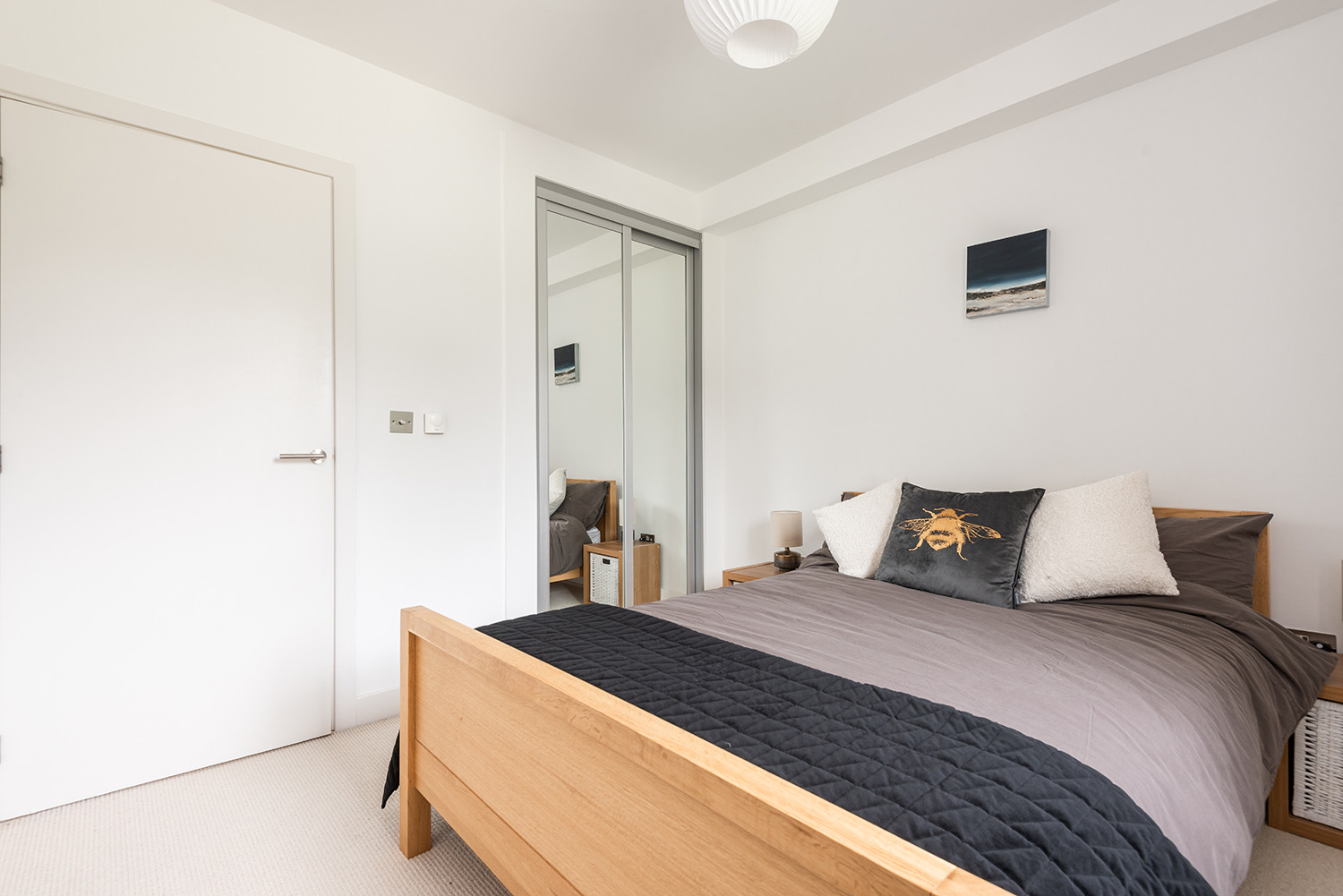 Bedroom 2 with double bed and built-in wardrobe.