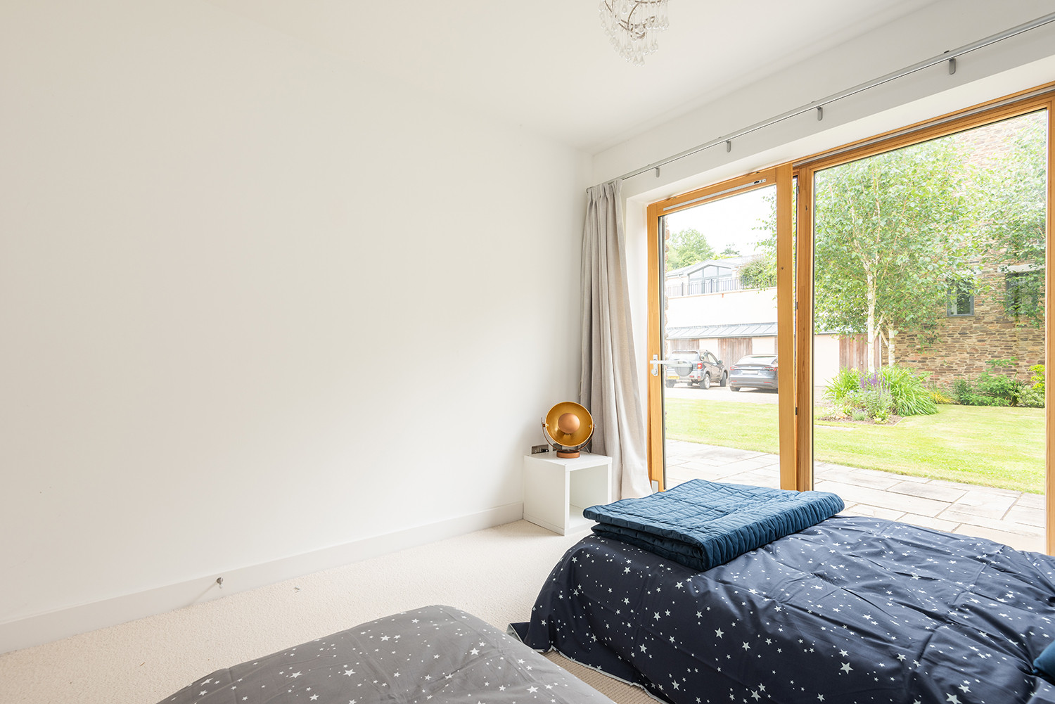Second sitting room with doors to private rear patio and sofa and chair bed made up