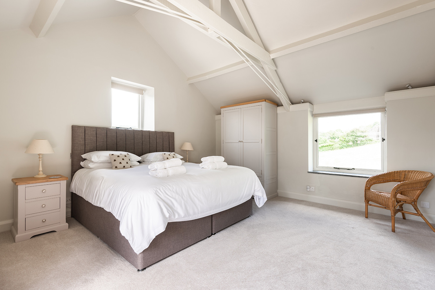 The spacious master bedroom with views over the paddock to the rear and out over South Pool and the estuary at the front.