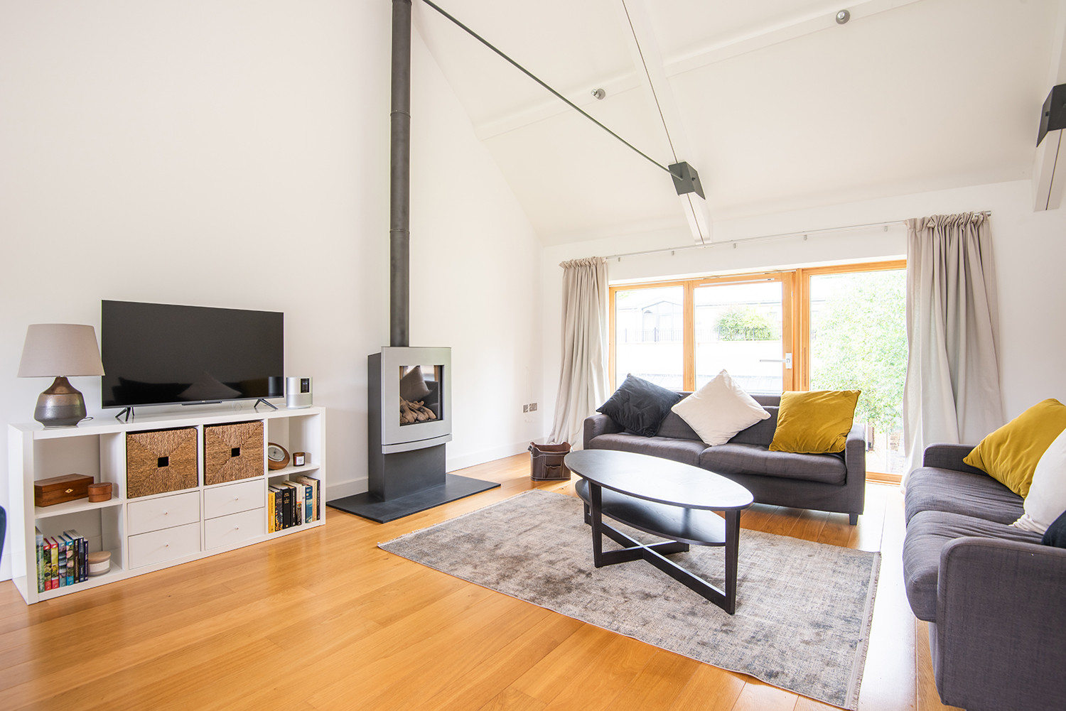 Spacious sitting room with vaulted ceilings.