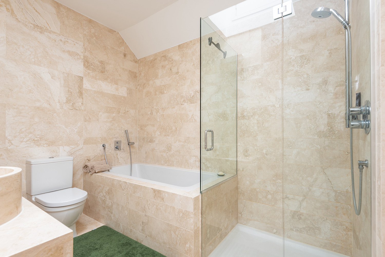 Master bedroom ensuite with bath and separate walk-in shower.