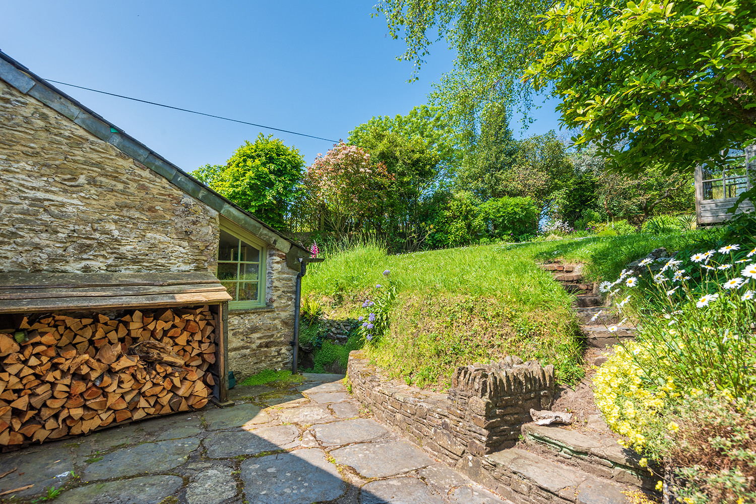Pretty patio area to the side of the cottage