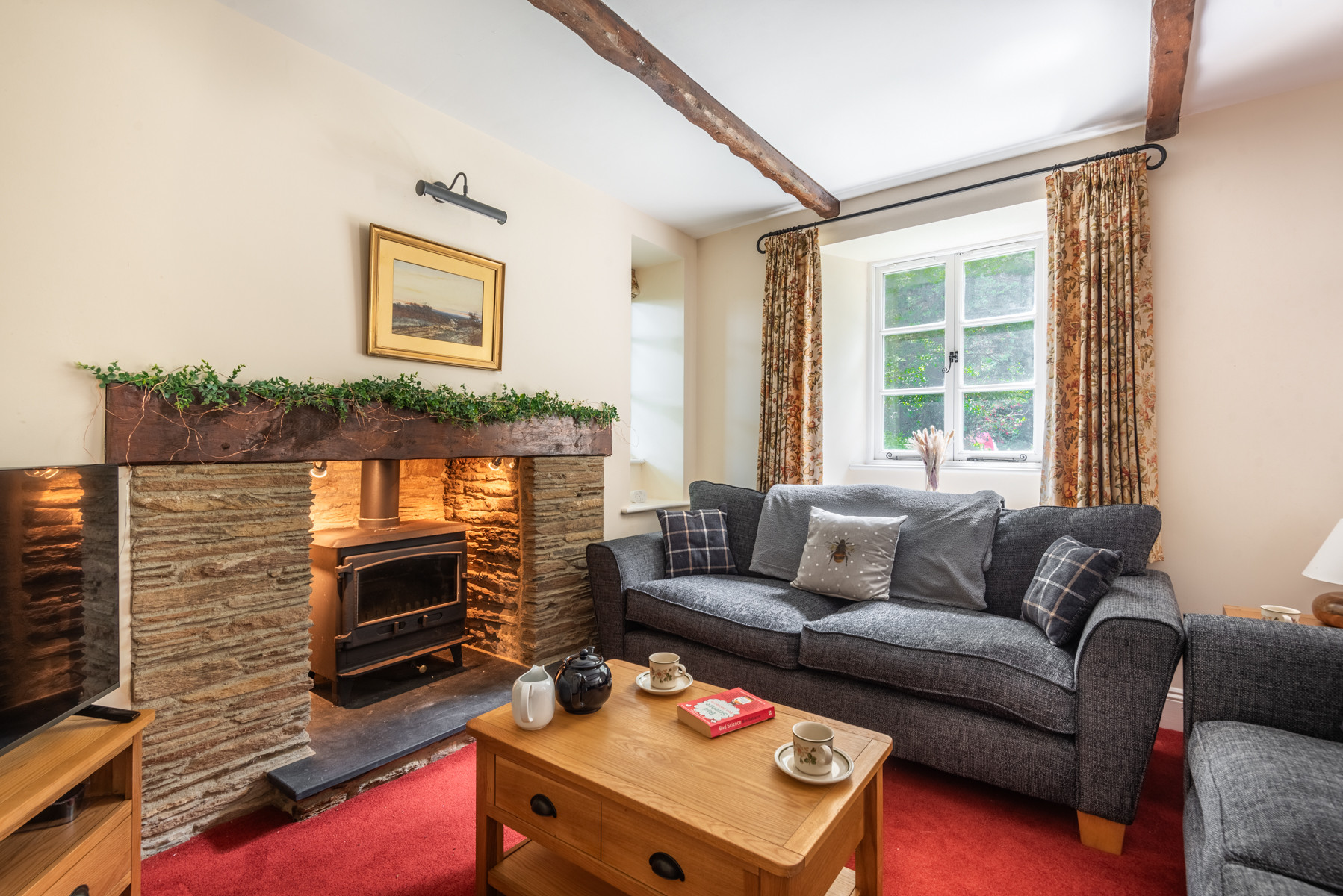 Cosy lounge with log burner -perfect for romantic breaks or cosy up with friends and family near the sea in South Devon