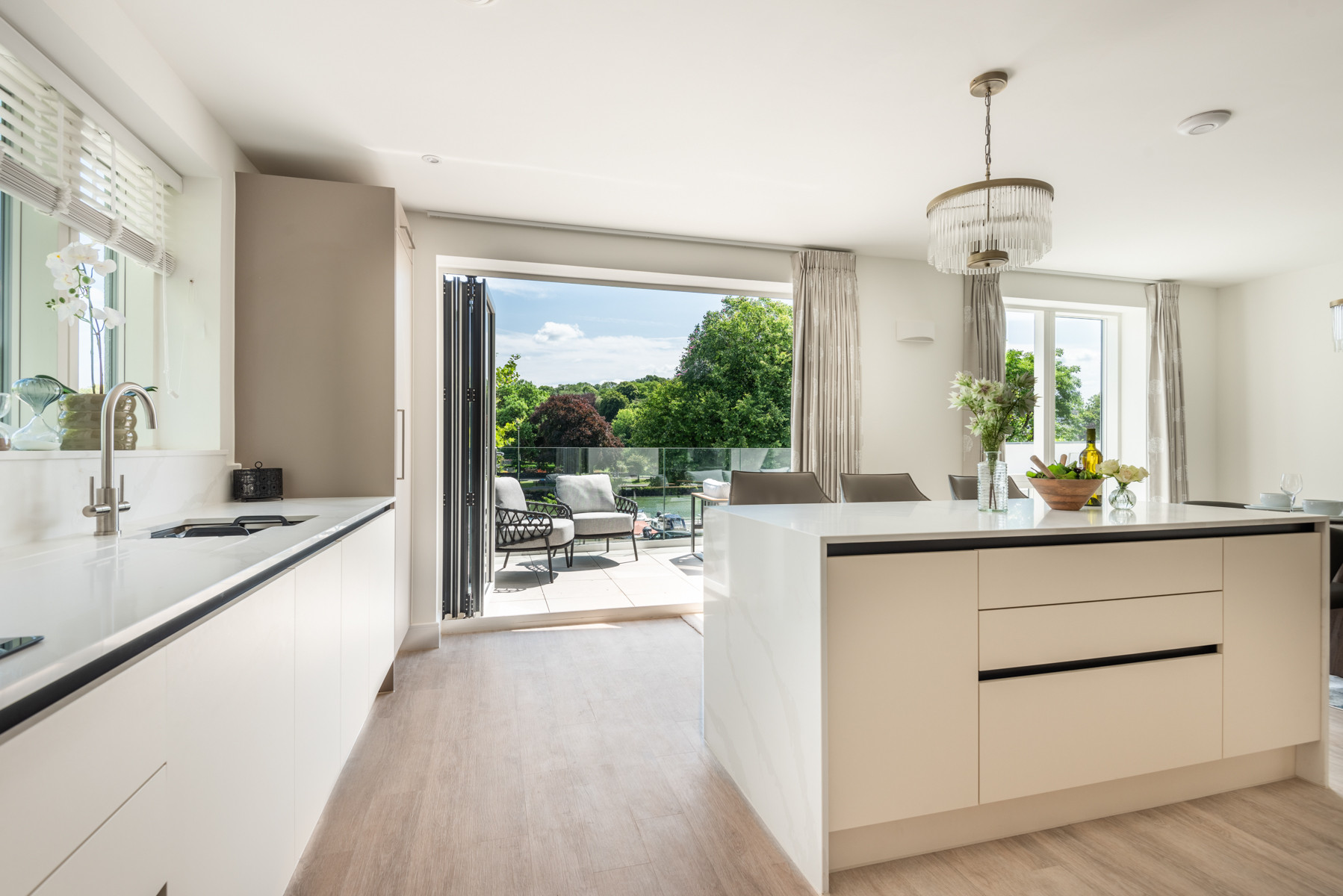 The contemporary kitchen diner leads on to the terrace