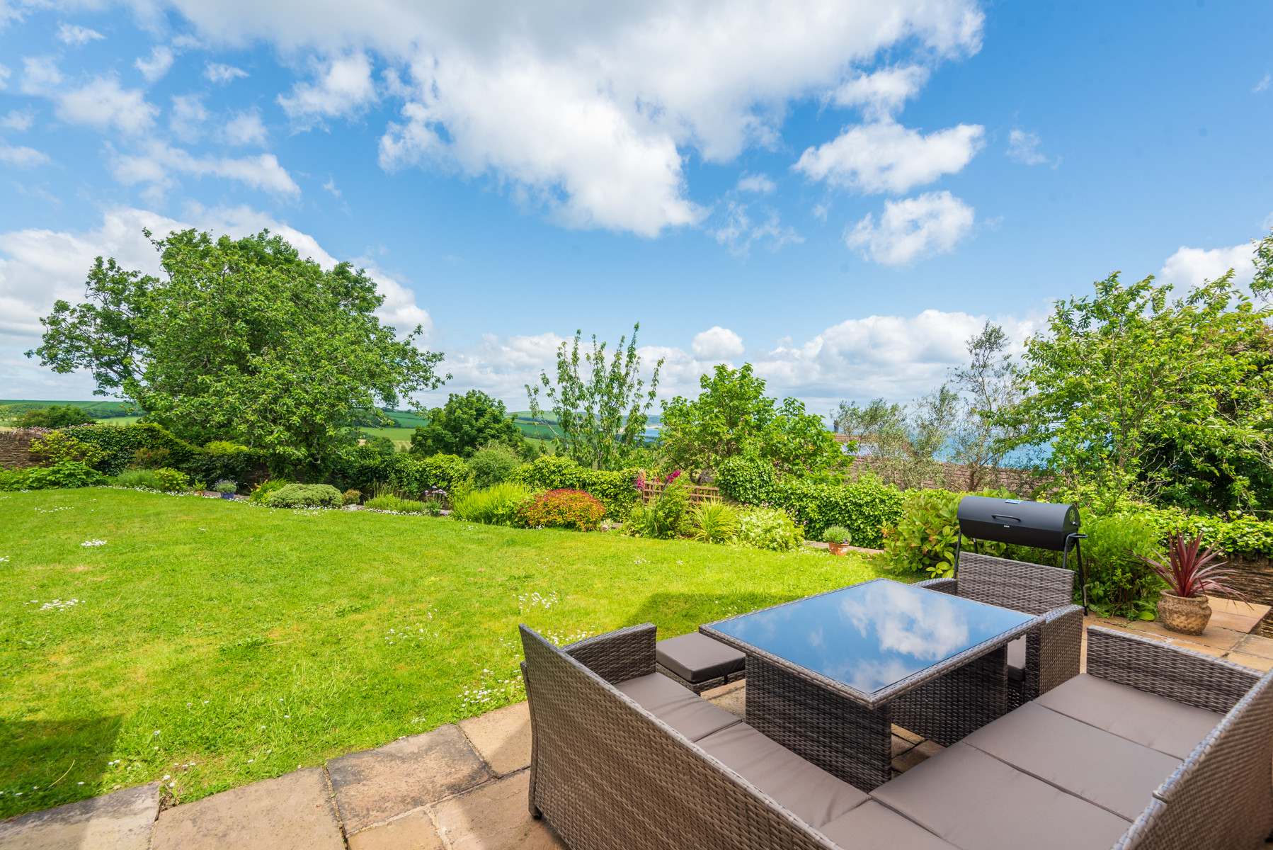 Space to relax and dine al fresco with glorious views over the fields and out to sea
