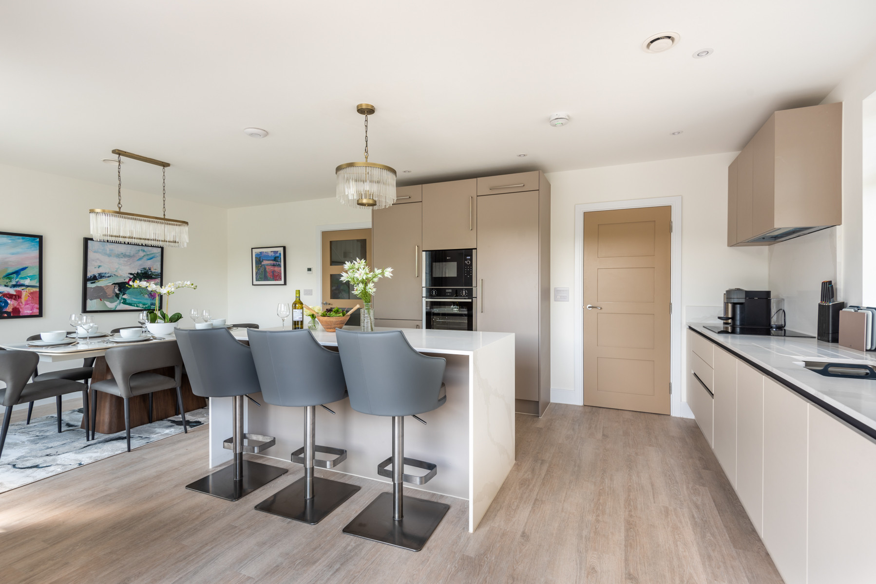 Contemporary kitchen with utility room leading off it