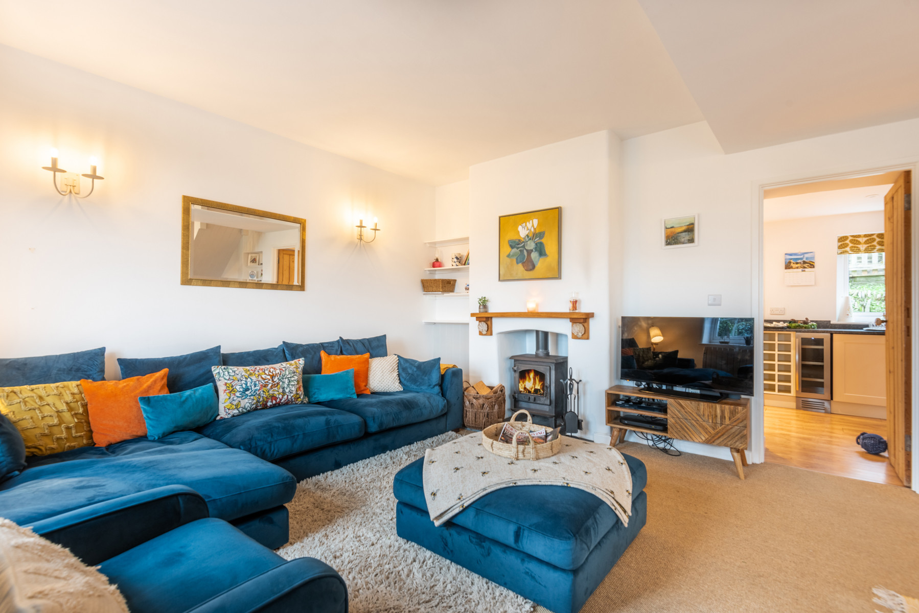 The pretty lounge area with log burner.