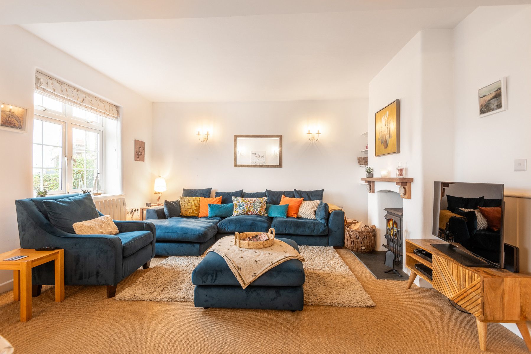 Another view of the lounge with log burner.