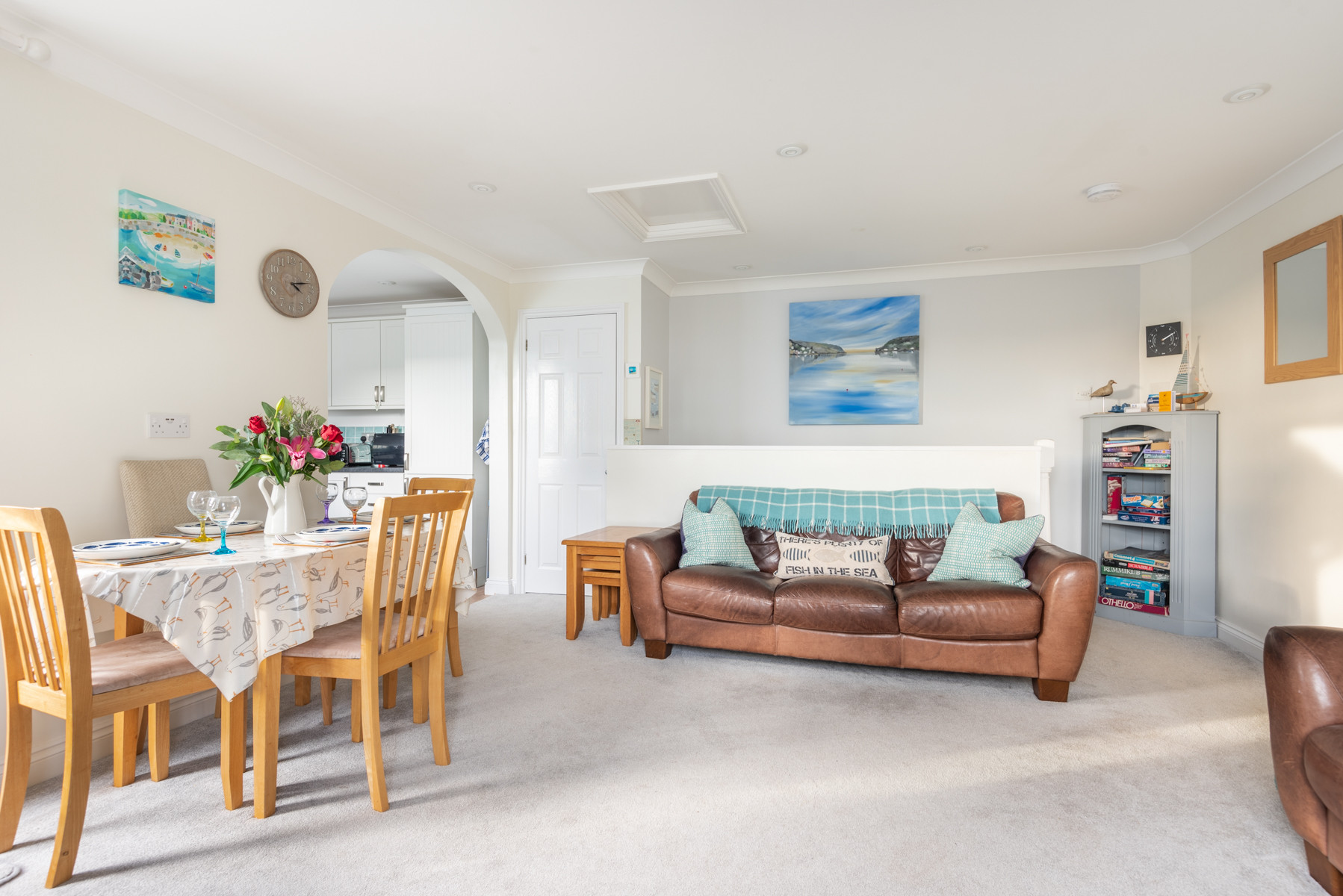 Space with the large sofas, stairs in the background