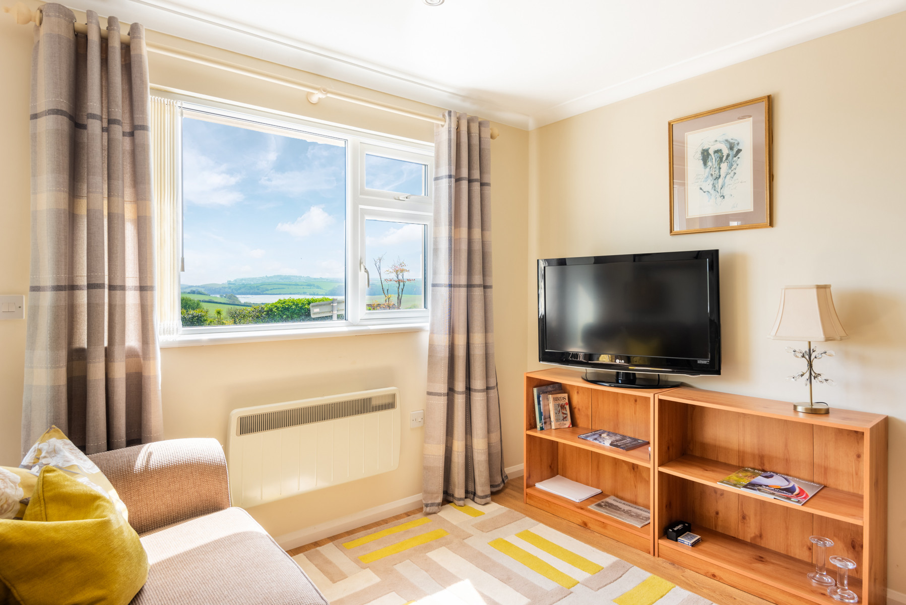The lounge and views over the countryside over the nature reserve to the estuary