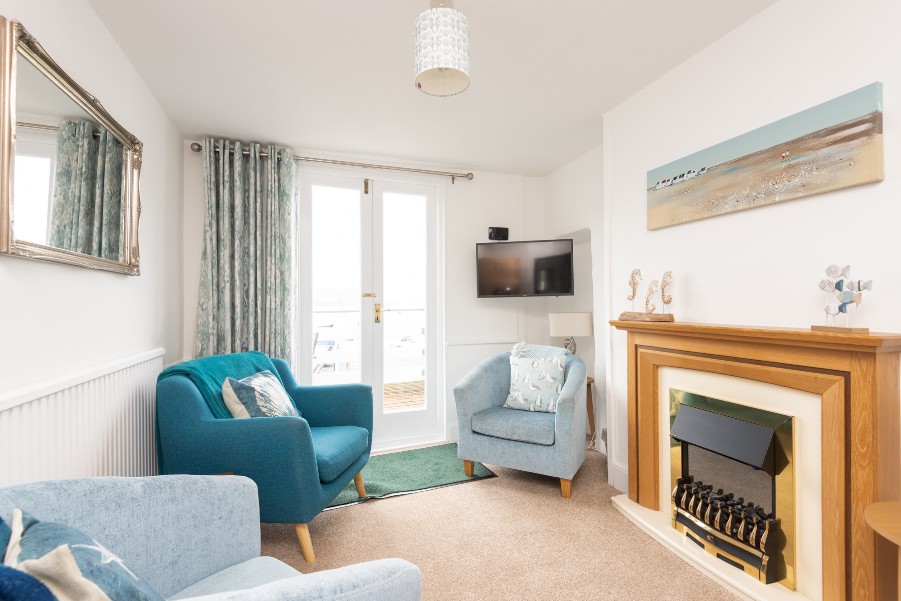 The lovely lounge with French doors onto the balcony.