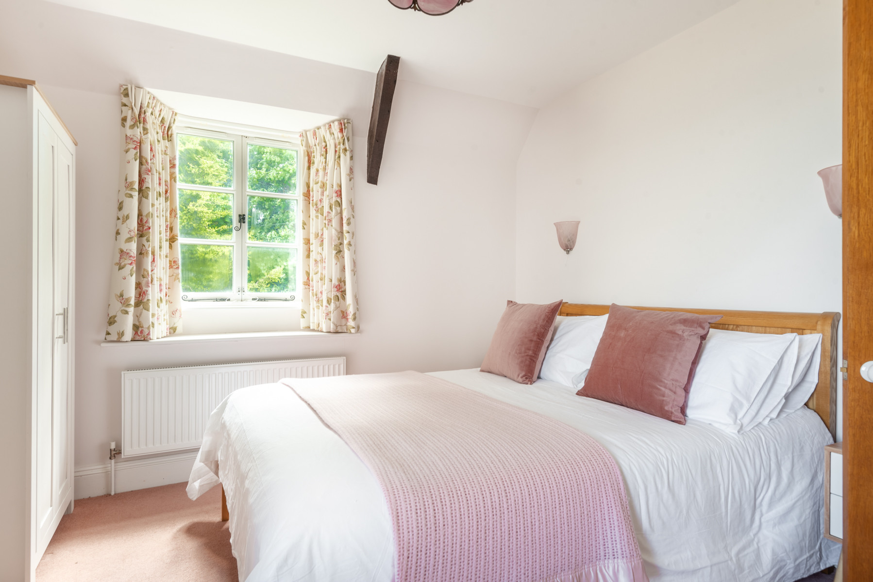 Another view of bedroom 1 with views to the lane and out to sea