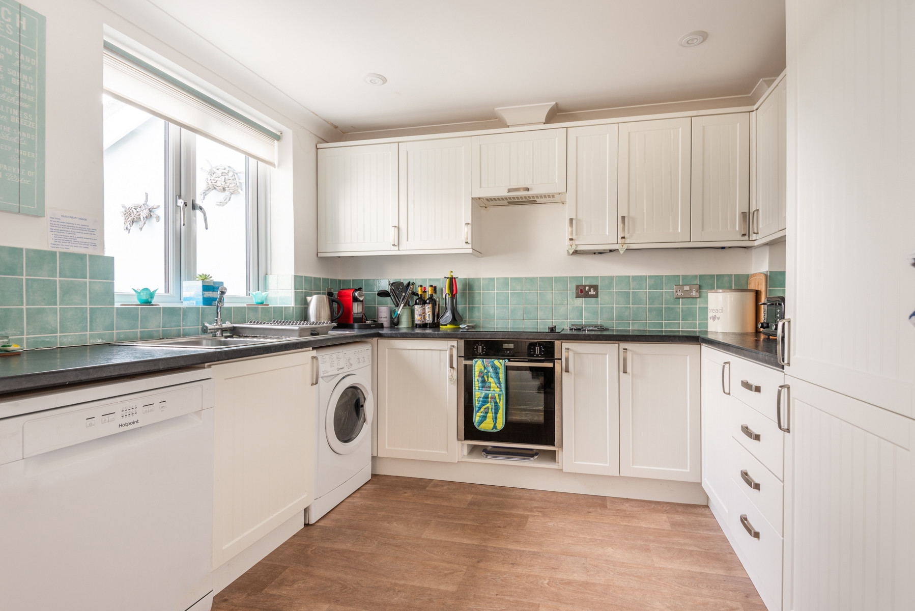 Kitchen showing the window with the light coming in 