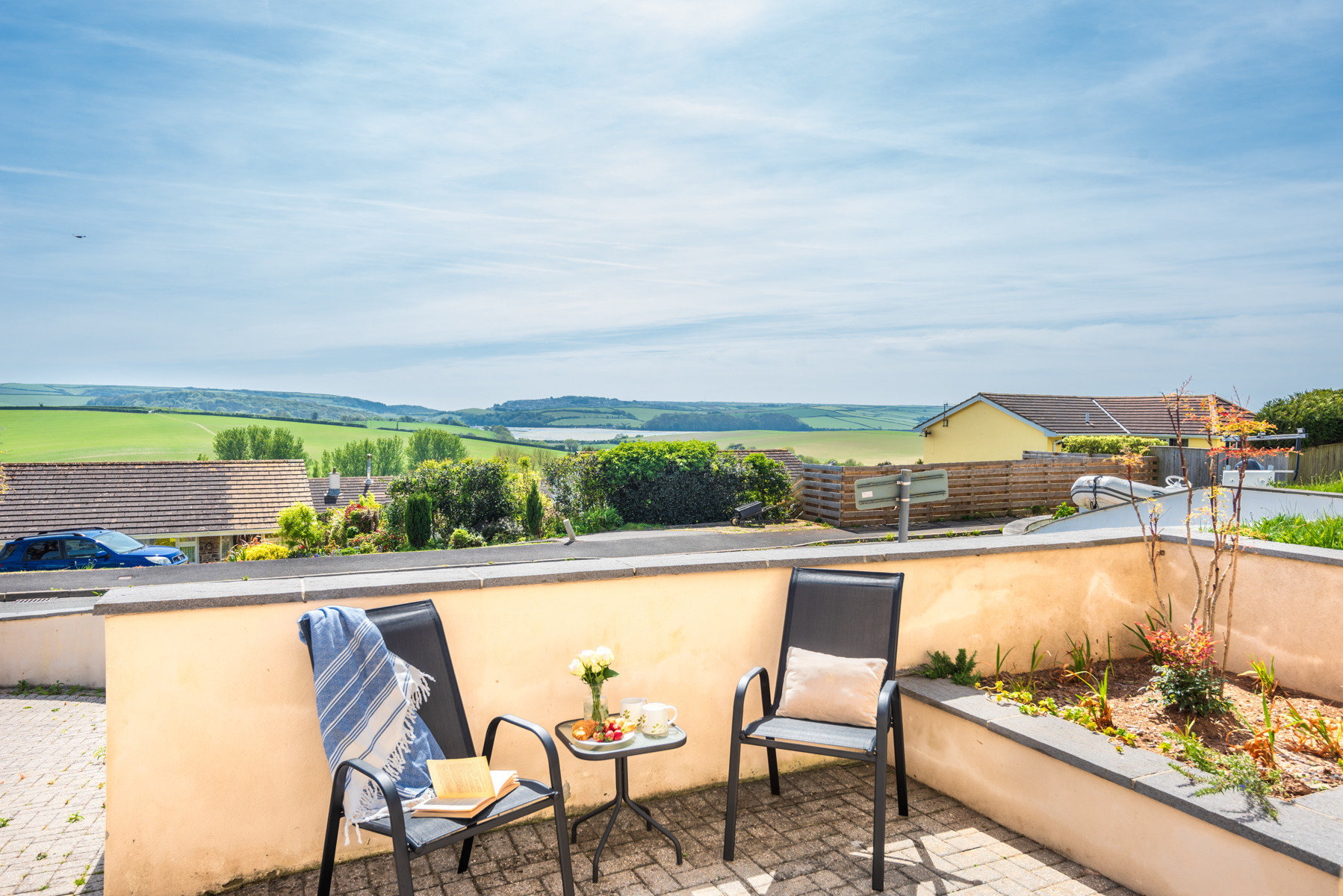 The terrace looks out over the village to the estuary