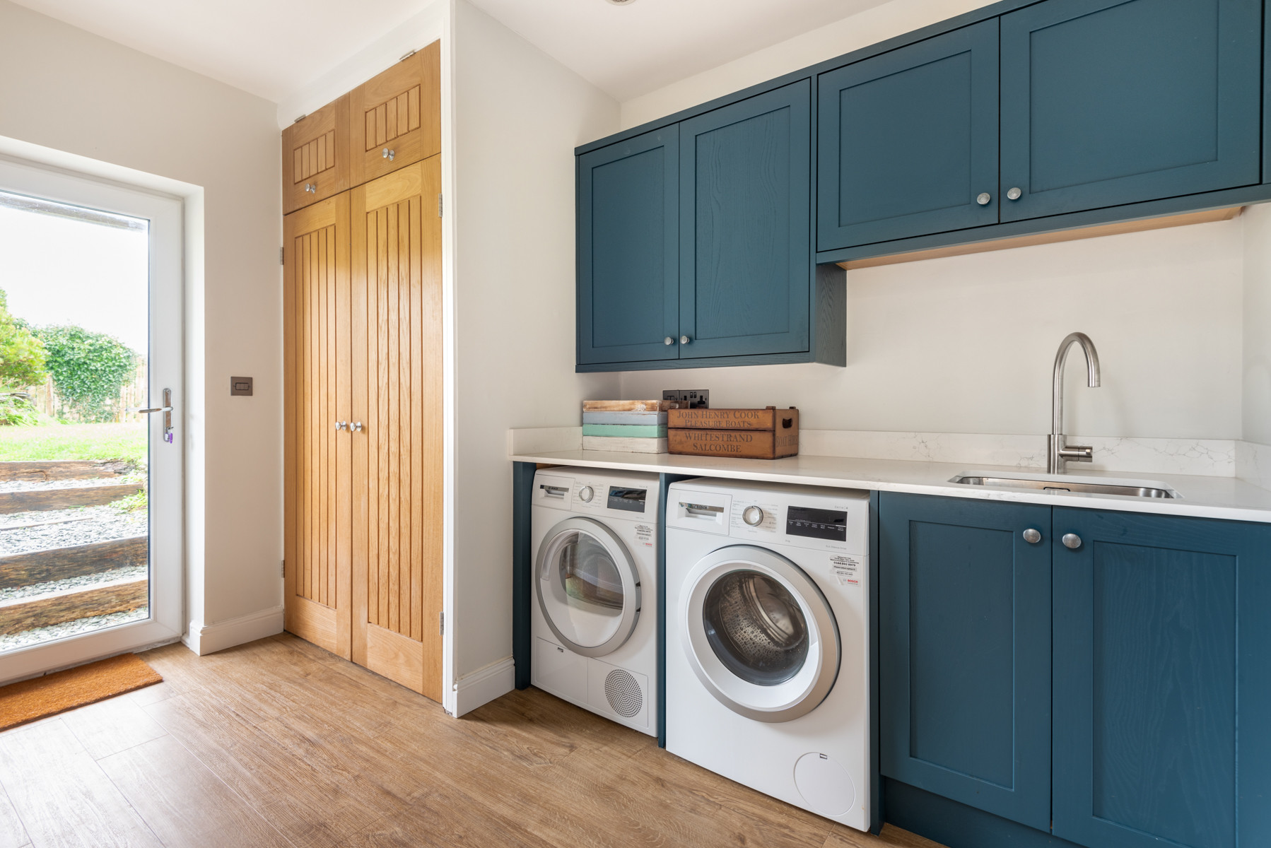 Spacious utility area with door to the rear garden