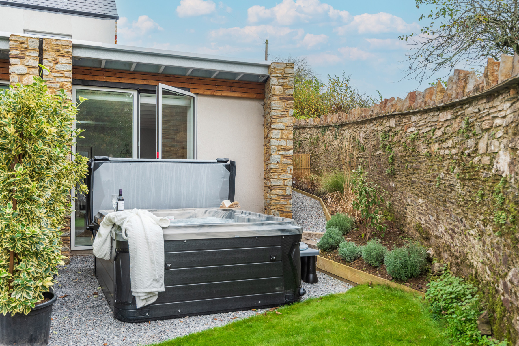 Looking over the hot tub to the back of the property