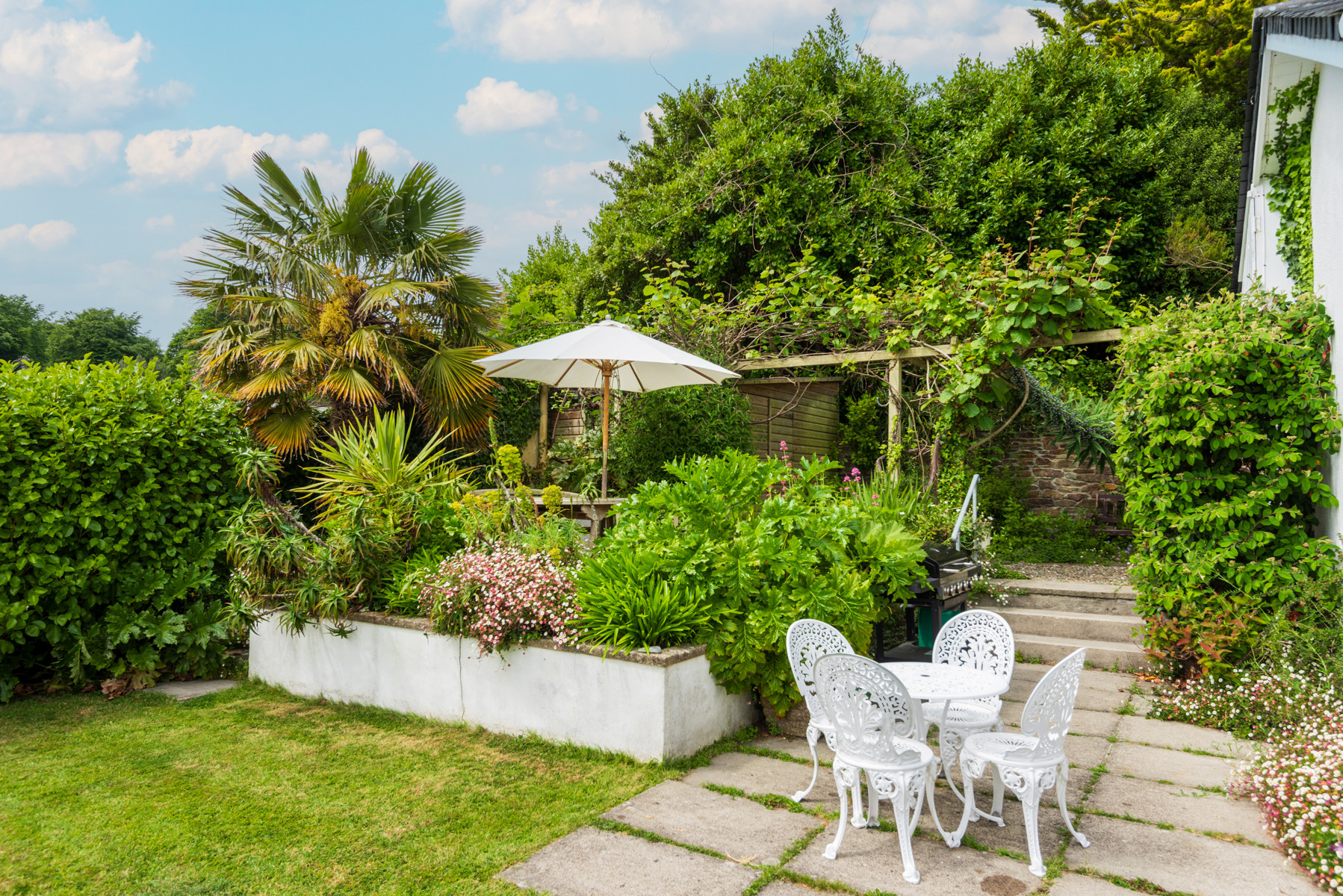 The shared garden with stunning views. Perfect sniffing ground for your four-legged friend!