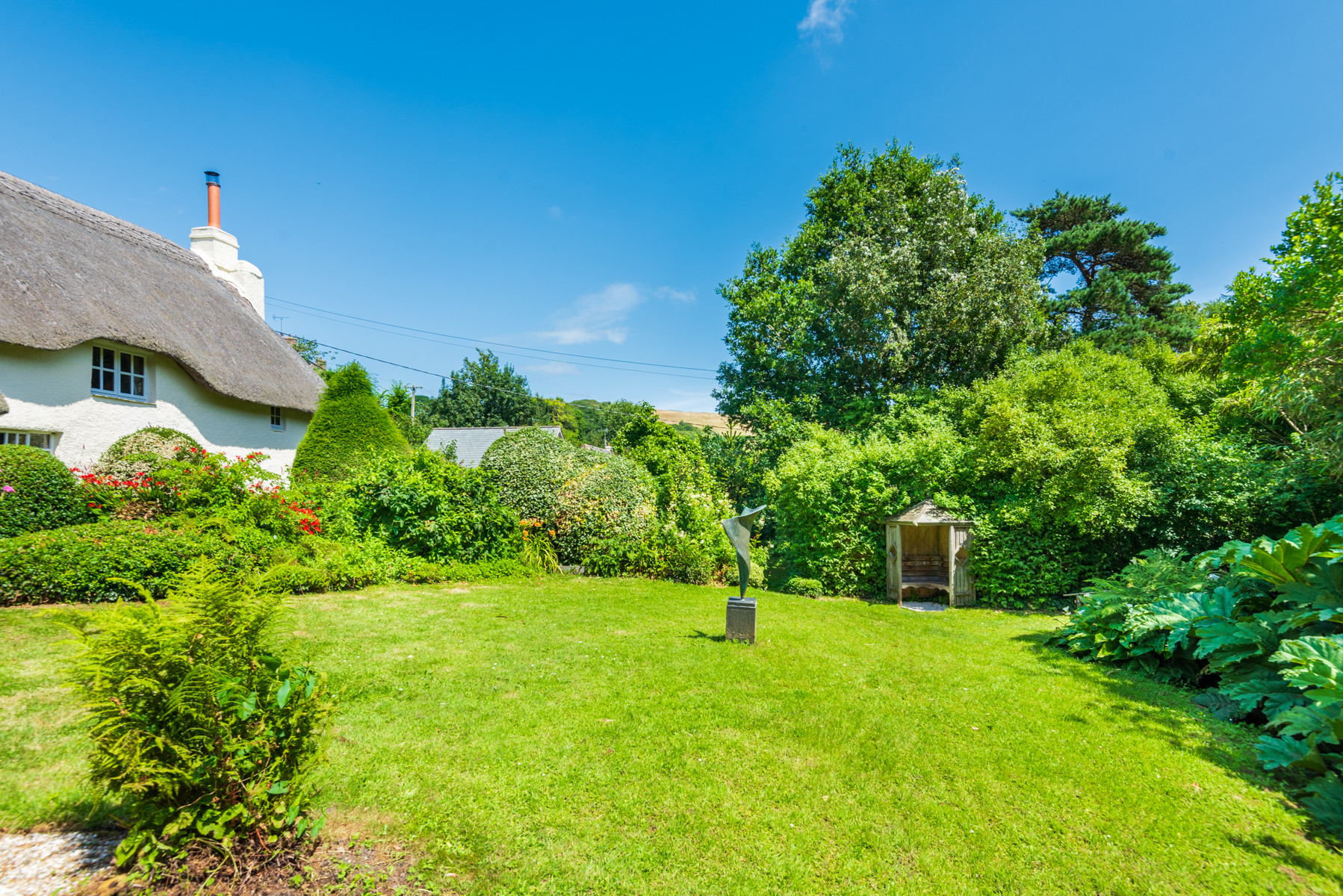 Large mature garden surrounding this chocolate box cottage